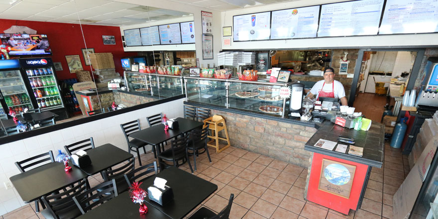 Photo of owner Larry Miller inside of GJP Italian Eatery in Oswego, NY.